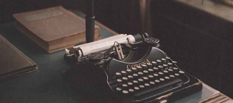 A typewriter on a desk.