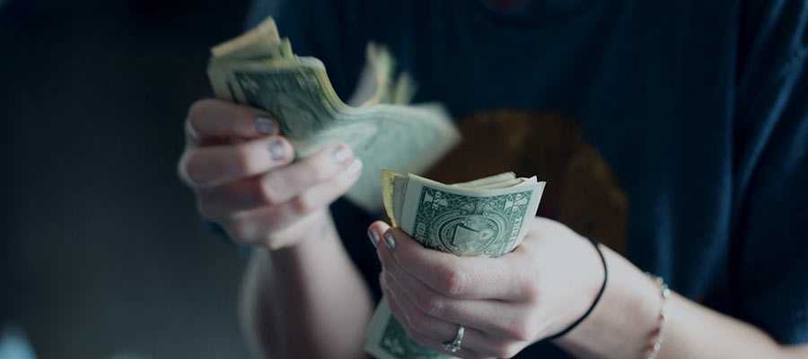 A person counting money.