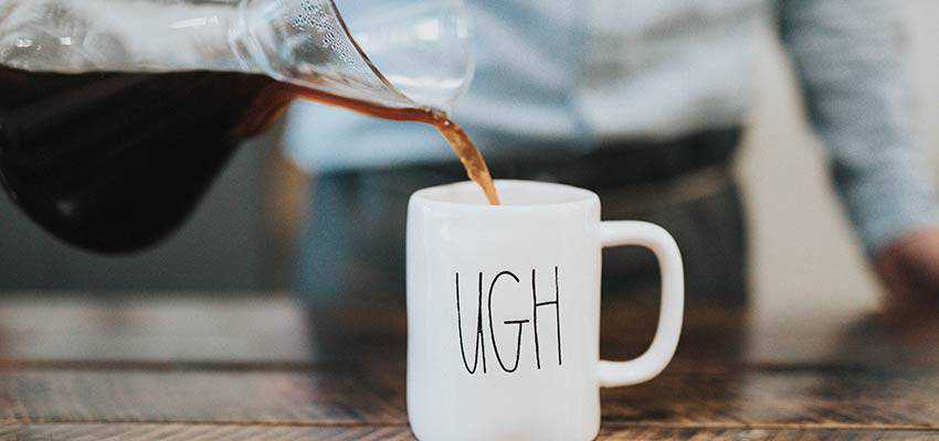 Coffee being poured into a mug.