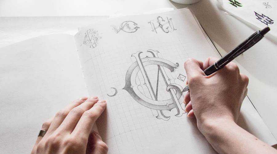 Monogram logo design sketch paper pencil pen inspiration