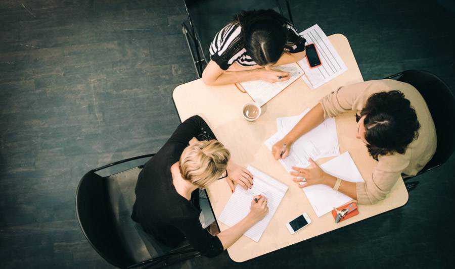 office discussion designer users desk overhead